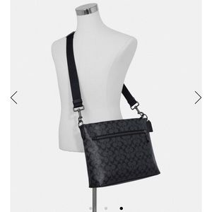 Charcoal gray Coach crossbody.